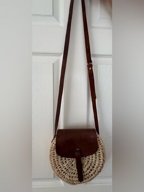 Ratan and leather strap round crossbody purse with flap